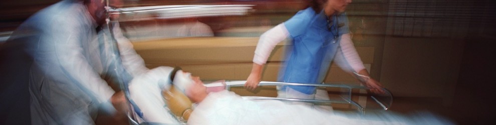 Physician and Nurse Pushing Gurney
